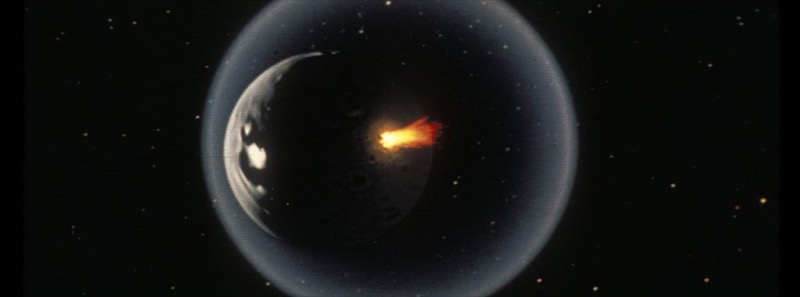 A planet seen from space with a ring of fire spreading across its surface.