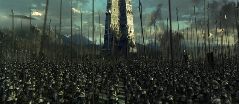 A huge army massed before a fortress at night.