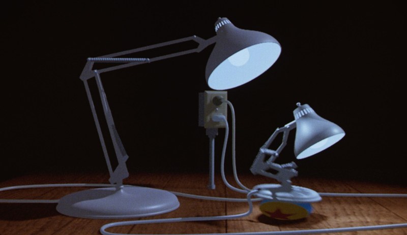 Two articulated desk lamps, a large one and a small one, with a ball.
