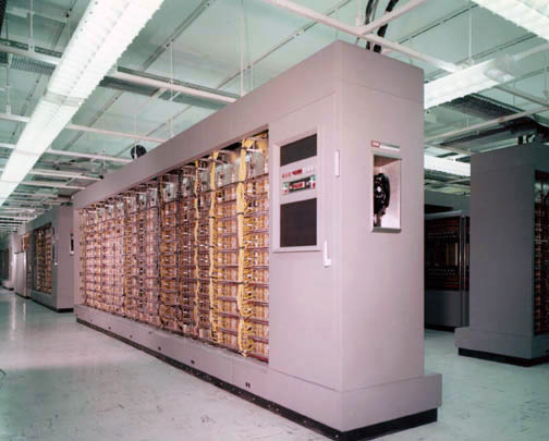 A SAGE computer room with rows of cabinets and operator consoles.