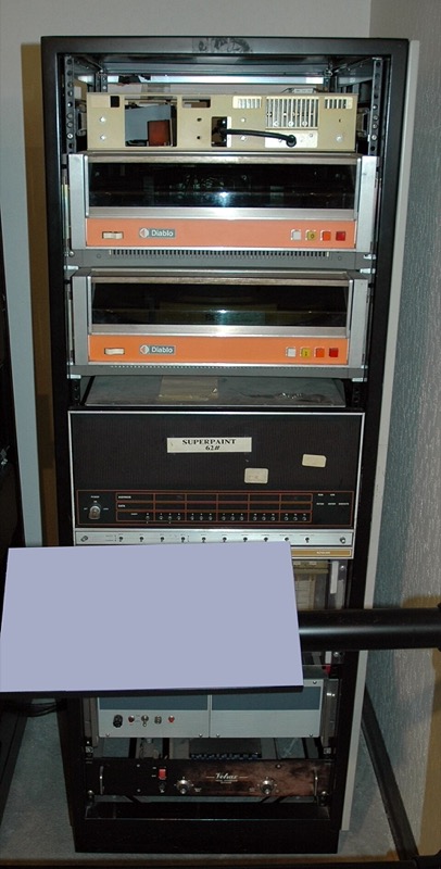 The SuperPaint system on display at the Computer History Museum: a monitor, a tablet and electronics racks.