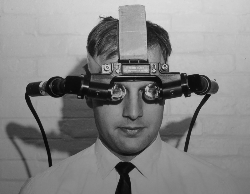 The 1968 head-mounted display: a headset with small CRTs hanging from a ceiling-mounted mechanical arm.
